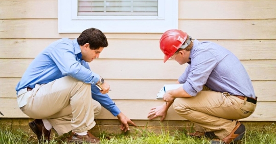 Inspectors checking home's foundation